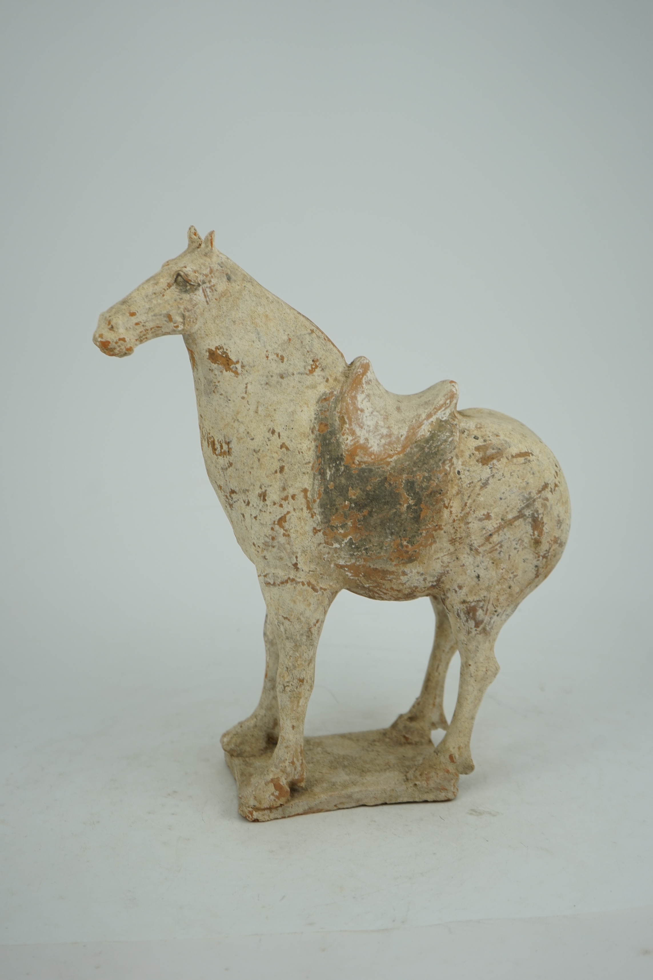 A Chinese painted pottery saddled horse, Tang Dynasty (AD 618-906)